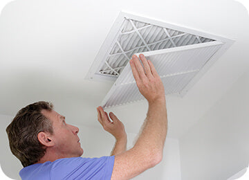 Man replacing filter.
